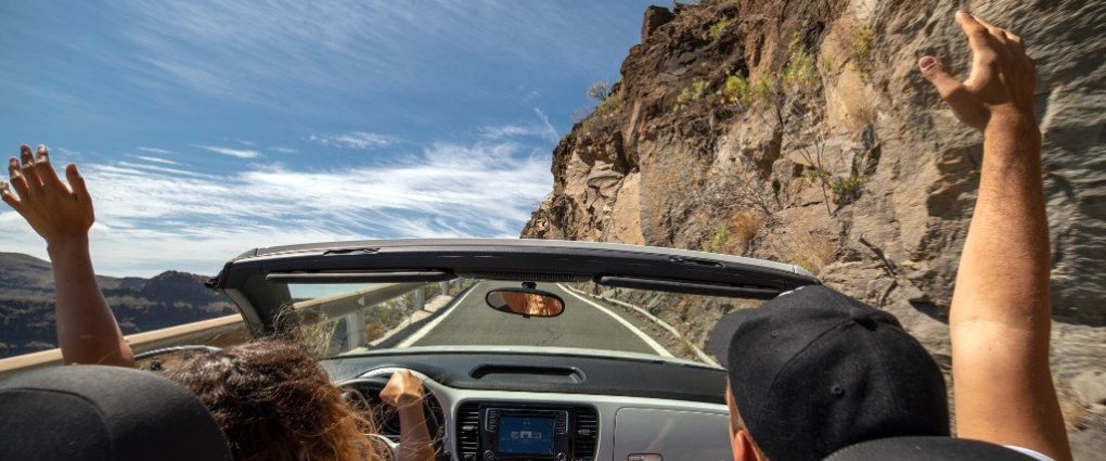 rent a car gran canaria las palmas a man and a woman taking a selfie in a car
